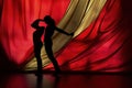 Silhouette Figures Dance with Red and Gold Fabric for Artistic Expression Royalty Free Stock Photo