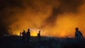 silhouette of a firefighter at the location of a forest fire