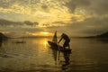 silhouette fisherman of Bangpra Lake in action when fishing, Thailand Royalty Free Stock Photo