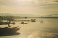 Silhouette fisherman on boat fishing in bang phra at sunrise Royalty Free Stock Photo