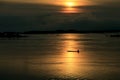 Silhouette fisherman on boat in Khong river at sunrise Royalty Free Stock Photo