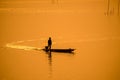 Silhouette fisherman on boat