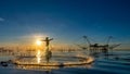 Silhouette of fisherman cast their nets to catch fish in the morning