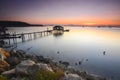 Silhouette of fisherman cottage during sunrise. Royalty Free Stock Photo