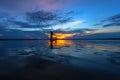 Silhouette fisherman with net at the lake