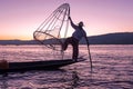 Silhouette of fisherman at sunset Inle Lake Burma Myanmar