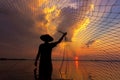 Silhouette fisherman with sunset,Take photo fisherman young woman with sunset