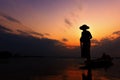 Silhouette fisherman with sunset,Take photo fisherman young woman with sunset