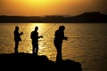 Silhouette of fisherman with sunset Royalty Free Stock Photo