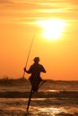 Silhouette of a fisherman at sunset, Unawatuna, Sri Lanka Royalty Free Stock Photo