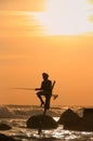 Silhouette of a fisherman at sunset, Unawatuna, Sri Lanka Royalty Free Stock Photo