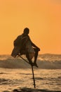 Silhouette of a fisherman at sunset, Unawatuna, Sri Lanka Royalty Free Stock Photo