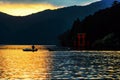 Silhouette fisherman at Torii gate, Hakone