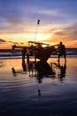 Silhouette of fishermen aktivity on Pangandaran Beach