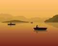 Silhouette of fishermen in a boat with fishing rods in the water. landscape with mountains, forest and sunset. Royalty Free Stock Photo