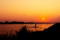 Silhouette of fishermen catch fish in the canal Royalty Free Stock Photo