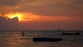 A silhouette of fishermen during sunset at Ba Keo Beach, Phu Quoc Island, Vietnam Royalty Free Stock Photo