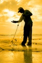 Silhouette of fishermen repair his nett Royalty Free Stock Photo