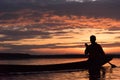 Silhouette of Fishermen throwing net fishing in sunset time at W Royalty Free Stock Photo