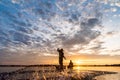 Silhouette of Fishermen throwing net fishing in sunset time at W Royalty Free Stock Photo