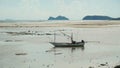 Silhouette of Fishing boat on a calm sea in sunlight. Sunset over the landscape and fishermen\'s boats in Thailand Royalty Free Stock Photo