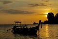 Silhouette of fishing boat and man at sunset on sea beach resort in Thailand, Krabi, Railey and Tonsai Royalty Free Stock Photo