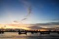 Silhouette of a fishing boat on a river