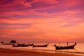 Silhouette of fishing boat on sea beach with sunset background Royalty Free Stock Photo