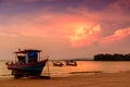 Silhouette of fishing boat on sea beach with sunset background Royalty Free Stock Photo