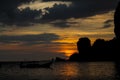 Silhouette of fishing boat sunset on sea beach resort in Thailand, Krabi Royalty Free Stock Photo