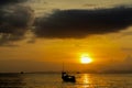 Silhouette of fishing boat at sunset on sea beach resort in Thailand, Krabi Royalty Free Stock Photo