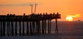 Silhouette of the fishing pier during sunrise near Virginia Beach, U.S.A Royalty Free Stock Photo