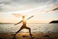 Silhouette of a fit woman practicing the warrior yoga pose again Royalty Free Stock Photo