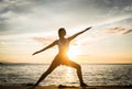 Silhouette of a fit woman practicing the warrior yoga pose again Royalty Free Stock Photo