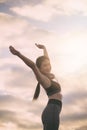 Silhouette fitness woman exercising at sunset time