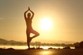 Silhouette of a fitness woman exercising yoga meditation exercise Royalty Free Stock Photo