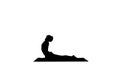 Silhouette Flexible strong yoga man in Upward and Downward Facing Dog Urdhva Mukha Svanasana. Royalty Free Stock Photo