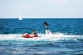 Silhouette of a fly board rider at sea. Royalty Free Stock Photo