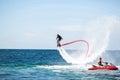 Silhouette of a fly board rider at sea. Royalty Free Stock Photo