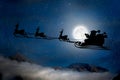 Silhouette of a flying goth santa claus against the background of the night sky. Royalty Free Stock Photo