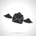Silhouette of flying opened envelope with wings