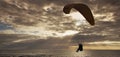 Silhouette of flying paraglider