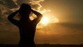 Silhouette of free woman at sunset on the beach Royalty Free Stock Photo