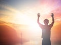 Silhouette freedom humble man rise hands up inspire good morning. Christian worship praise God in thanksgiving day Prayer Financia Royalty Free Stock Photo