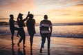 Silhouette, friends and at the beach or sea relax, happy and have fun with sunset view on vacation together. Group, men Royalty Free Stock Photo