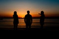 Silhouette of friends on beach Royalty Free Stock Photo