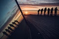 Silhouette of friends enjoying sunset Royalty Free Stock Photo