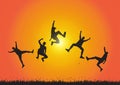 Silhouette of friends jumping over meadow on golden sunrise background, happy life, winning and achievement concept Royalty Free Stock Photo