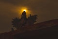 Silhouette of GARUDA idol during sunset in the background Royalty Free Stock Photo