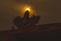 Silhouette of GARUDA idol during sunset in the background Royalty Free Stock Photo